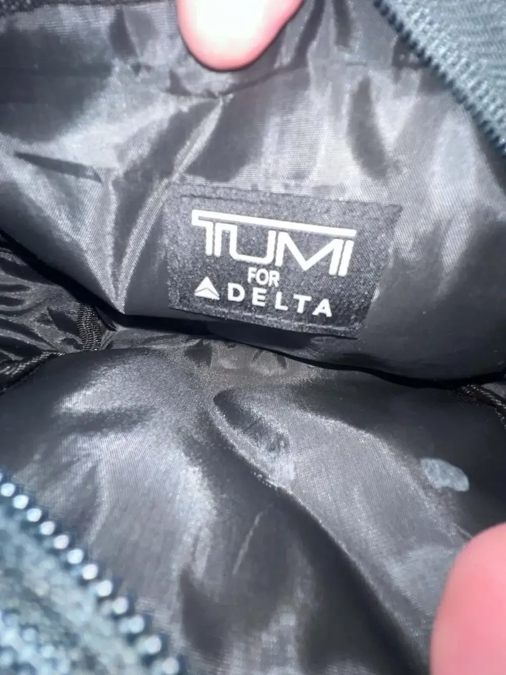 Tumi tags or toiletries
